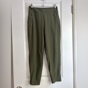Athleta Olive Green Brooklyn joggers with zippered pockets and zippered bottoms